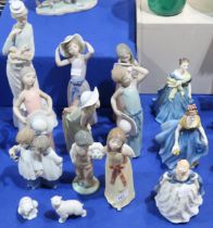 A collection of Lladro and Nao figures and three Royal Doulton ladies Condition Report:Available