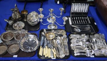 A part silver plated cutlery set together with two silver plated candelabra, wine coasters, cased