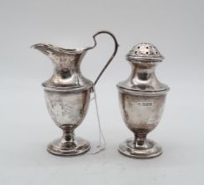 A silver salt and cream jug, by Cooper Brothers & Sons, Sheffield, of baluster form, with banding,