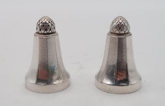 Georg Jensen; a silver salt and pepper pot, with acorn tops, the bodies faceted, impressed 423B, 4.