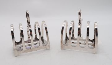 A pair of silver four division toast racks, by James Deakin & Sons, Sheffield,  with horse-shoe