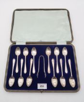 A cased set of silver tea spoons and sugar tongs, by Duncan & Scobie, Sheffield, in the feathered