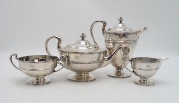 A GEORGE V FOUR PIECE SILVER TEA SERVICE by Lawson & Co, Glasgow 1919, of baluster form, with banded