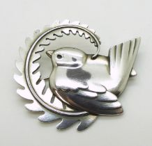 A GEORG JENSEN BROOCH number 309, designed by Arno Malinowski bird with a fern. Fully stamped with