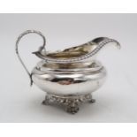 A WILLIAM IV SILVER CREAM JUG by Edward, John & William Barnard, London 1831, of squat circular