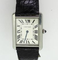 A CARTIER TANK WRISTWATCH with silvered dial, black roman numeral and blued steel hands, reference