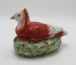 A LATE 19TH CENTURY PIGEON TUREEN the fancy brown and white pigeon modelled seated on a nest, 20cm