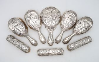 A COLLECTION OF ART NOUVEAU SILVER DRESSING TABLE ITEMS one five piece set by Sydney & Co,