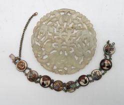 A CHINESE HARDSTONE PIERCED CIRCULAR DISC carved with a bat and calligraphy,7.5cm diameter and a Sa