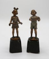 J.H. LAND -  A pair of gilt bronze and enamel Art Deco figures, modelled as boy with accordion and