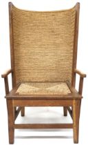 A 20TH CENTURY BEECH FRAMED ORKNEY CHAIR  with rush backrest over rush drop in seat flanked by