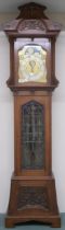 AN IMPRESSIVE ARTS & CRAFTS OAK CASED CHIMING MOONPHASE LONGCASE CLOCK RETAILED BY "THE