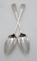 A PAIR OF GEORGE III IRISH SILVER SERVING SPOONS maker's mark JK, Dublin 1798, in the Old English