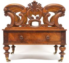 A VICTORIAN WALNUT CANTERBURY  with four fretwork dividers joined by turned stretchers over single