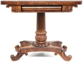 A VICTORIAN ROSEWOOD FOLD-OVER CARD TABLE  with rectangular top with rounded corners concealing