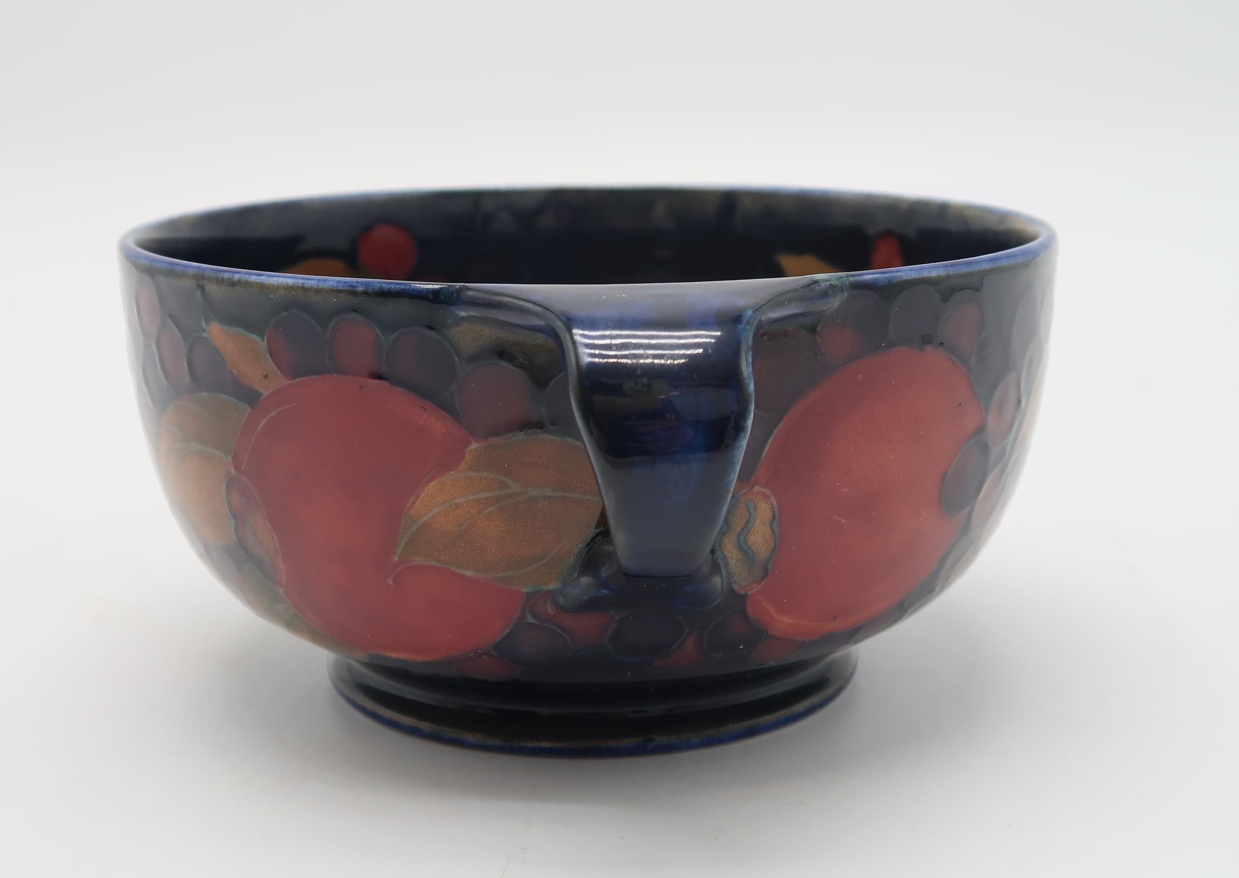 A MOORCROFT LEAF AND BERRY FLAMBE PATTERN DISH raised on a pedestal, blue signature to base and - Image 7 of 9