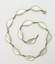 A DAVID ANDERSEN NECKLACE the classic white enamelled leaf necklace , is made in gilded sterling