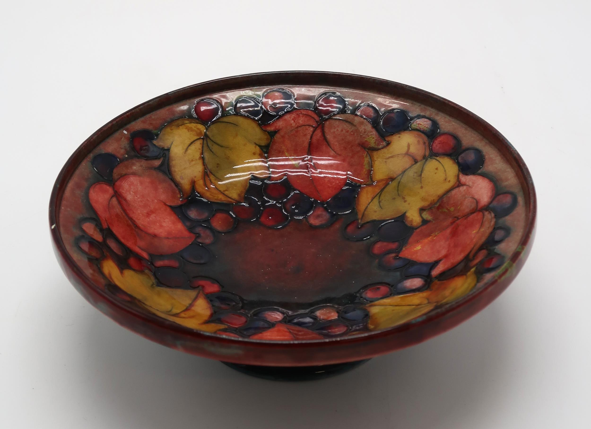 A MOORCROFT LEAF AND BERRY FLAMBE PATTERN DISH raised on a pedestal, blue signature to base and - Image 2 of 9