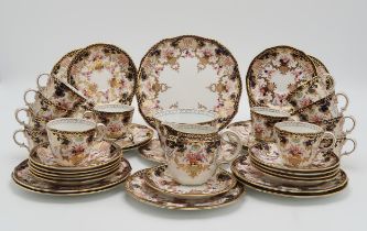 A ROYAL CROWN DERBY TEASET in 3788 Imari pattern, comprising twelve tea cups, saucers, plates,