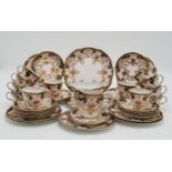 A ROYAL CROWN DERBY TEASET in 3788 Imari pattern, comprising twelve tea cups, saucers, plates,