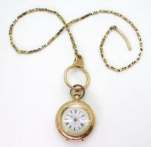 A 14K GOLD DECORATIVE FOB & CHAIN a ladies Swiss hallmarked fob watch with a French enamelled