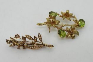 TWO VINTAGE BROOCHES a 9ct gold lily flower and peridot brooch, hallmarked London 1973, made by