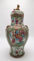 A CANTONESE BALUSTER VASE AND COVER Painted with panels of figures, birds, flowers and insects,