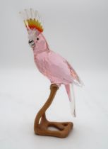 A SWAROVSKI CRYSTAL BIRDS OF PARADISE  FIGURE of a Cockatiel on wooden base, 23cm high Condition