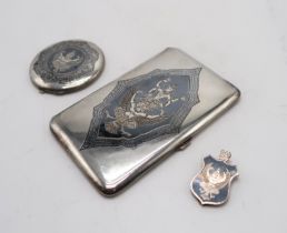 A THAI SILVER ILNAID CIGARETTE CASE by F.W Margrett & Co, of rectangular form, depicting Garuda