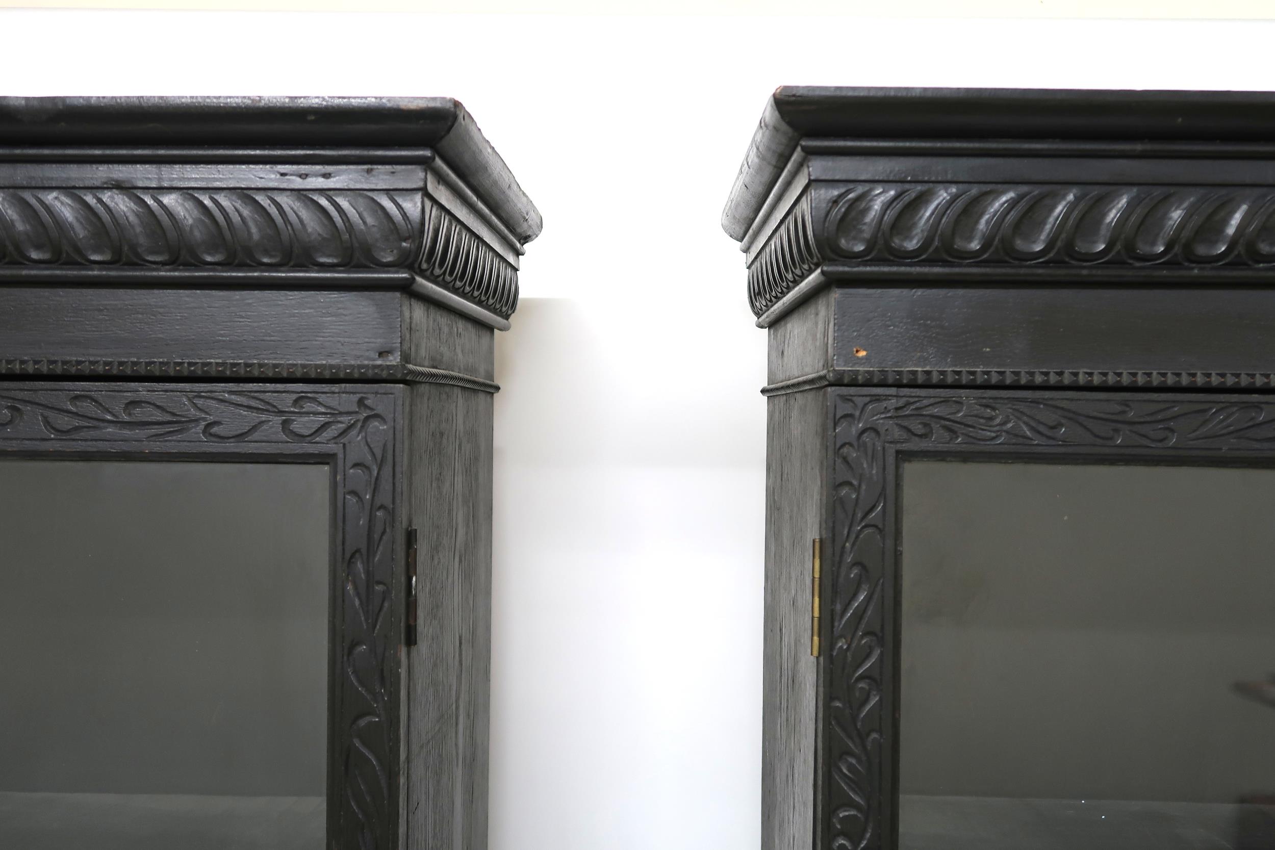 A PAIR OF 20TH CENTURY EBONISED GLAZED BOOKCASES  with gadrooned moulded cornices over pairs of - Image 8 of 12