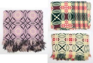 THREE 20th CENTURY WELSH BLANKETS Two, matching, woven in pink, green and pale yellow over an off-