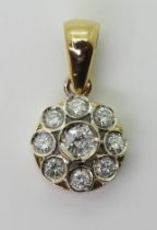 A DIAMOND FLOWER PENDANT mounted in 18ct gold and set with estimated approx 0.60cts of brilliant cut