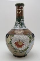 A JAPANESE BALUSTER VASE  painted with chrysanthemum, Ho-o birds, crashing waves and clouds, with