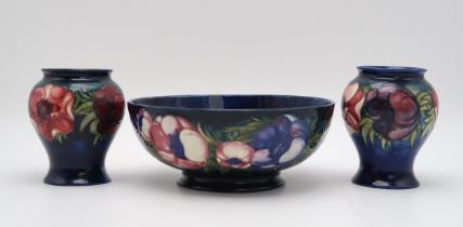 A LARGE MOORCROFT ANEMONE PATTERN BOWL with tube line decoration of flowers to the exterior,  with