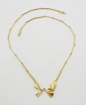 AN 14CT LAPPONIA NECKLACE an abstract winged form with baton links and box clasp, signed Lapponia