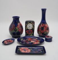 A COLLECTION OF MOORCROFT ANEMONE PATTERN PIECES including a bottle vase, 27cm high, a baluster