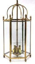 AN EARLY 20TH CENTURY VAUGHAN REPRODUCTION BRASS HEXAGONAL HALLWAY LANTERN  with scroll top