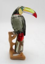 A SWAROVSKI CRYSTAL BIRDS OF PARADISE  FIGURE of a Toucan on wooden base, 20cm high Condition