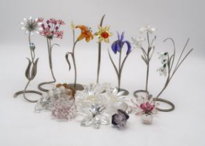 SEVEN SWAROVSKI CRYSTAL FLOWER GROUPS including iris and snowdrops, all on metal stands, together