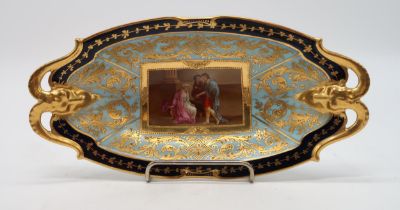 A VIENNA PORCELAIN DISH with rams head handles, the centre painted panel of figures surrounded by