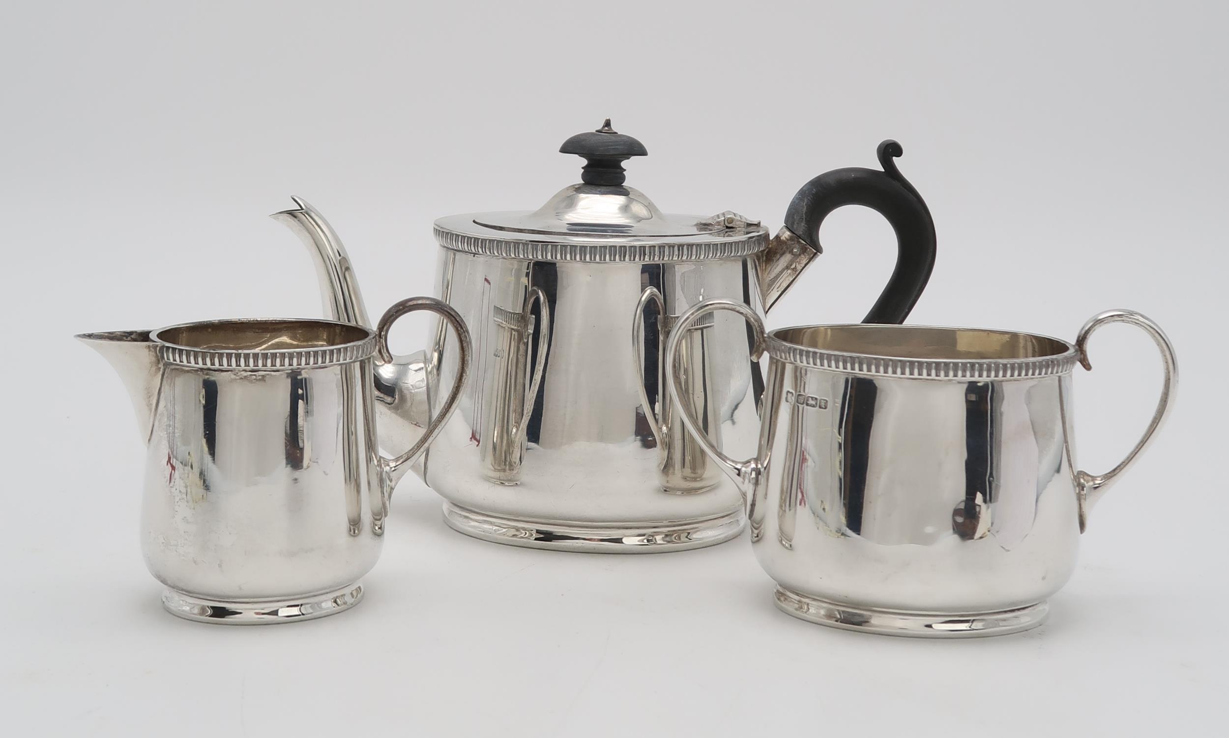 A GEORGE V BACHELORS SILVER TEA SERVICE by Martin Hall & Co, Sheffield 1915, of oval form, with