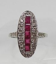 A RUBY AND DIAMOND PANEL RING mounted in 18ct white gold, finger size N, weight 3.9gms Condition