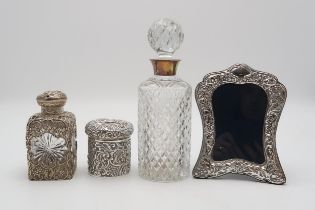 A COLLECTION OF SILVER including a late Victorian overlaid silver cut glass perfume flask, by