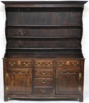 A LATE 18TH/EARLY 19TH CENTURY OAK KITCHEN DRESSER  with moulded cornice over three open plate