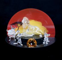 FOUR SWAROVSKI CRYSTAL WALT DISNEY CHARACTERS FROM THE LION KING including Mufasa, Simba, Pumba, and