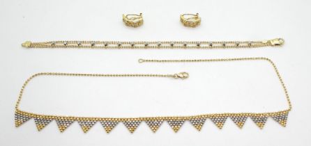 BI COLOUR GOLD JEWELS an 18ct yellow and white gold triangular fringe necklace with a small bead