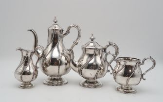 A MATCHED FOUR PIECE SILVER TEA SERVICE the hot water pot and cream jug by Robert Hennell II, London