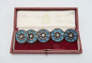 LIBERTY& CO; A set of five Cymric silver & enamel buttons, Birmingham 1901, decorated turquoise
