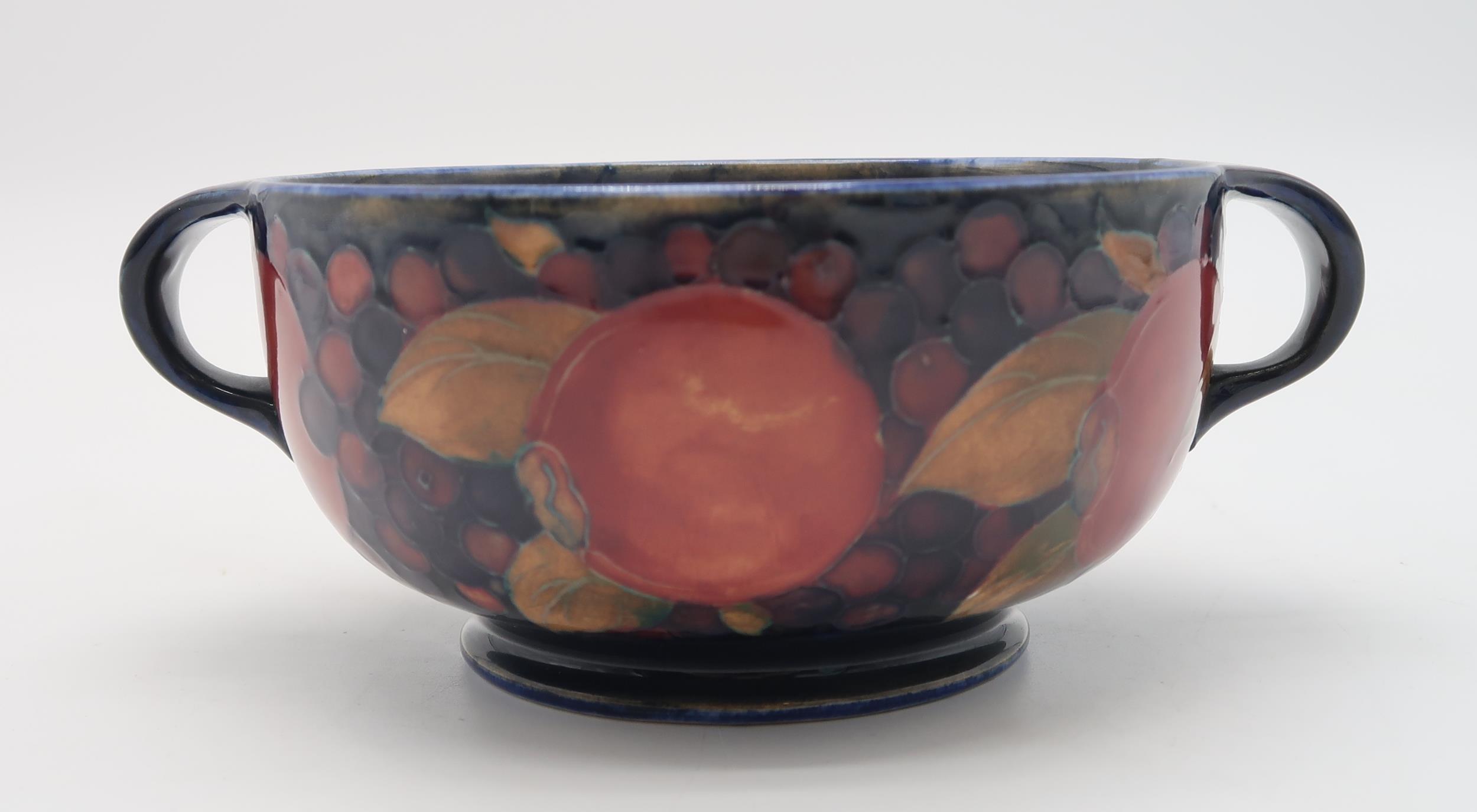 A MOORCROFT LEAF AND BERRY FLAMBE PATTERN DISH raised on a pedestal, blue signature to base and - Image 6 of 9