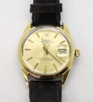 A ROLEX OYSTER PERPETUAL DATE the gold plated watch has a gold coloured dial, baton numerals and